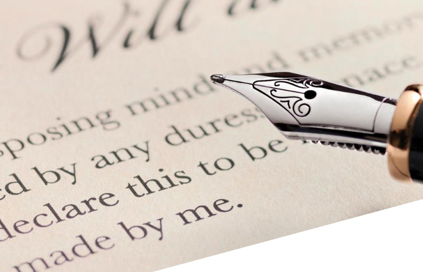 A fountain pen resting on top of a will document