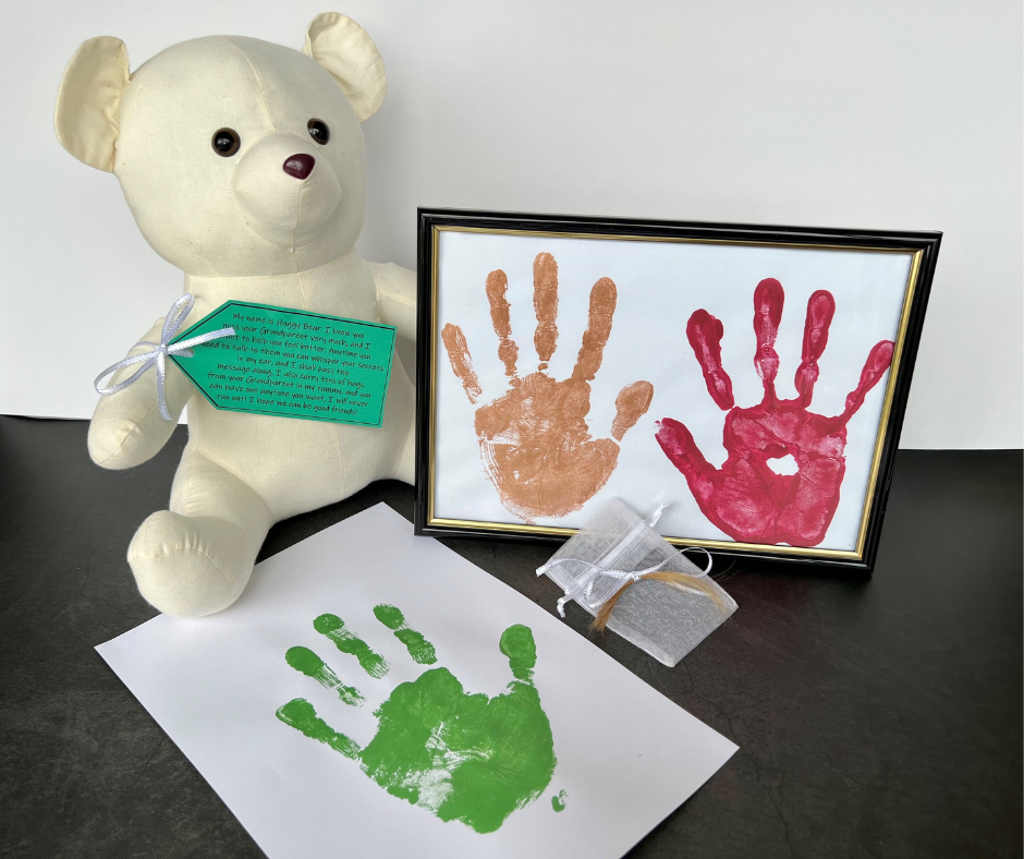 teddy bear with painted hand prints in memory loss program louisa hope fund for nurses