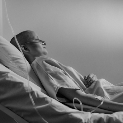 Cancer Patient In Hospital Bed