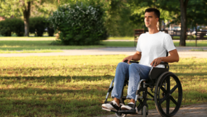 man sitting in a wheelchair looking pensive